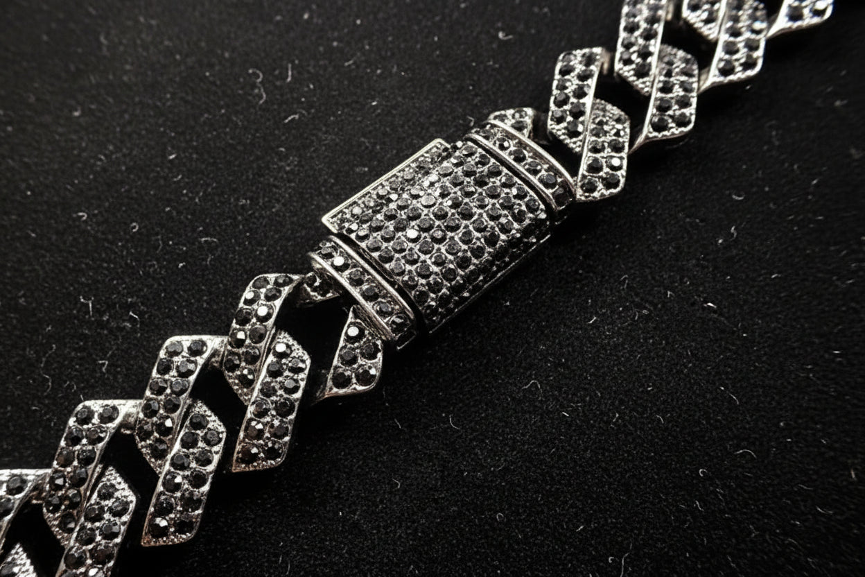 Silver bracelet with diamond-like stones on a black background
