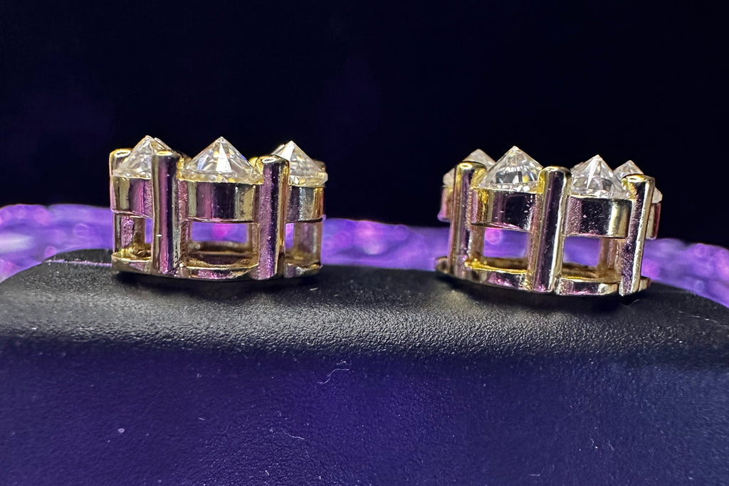 Gold bracelet with diamonds on a dark background