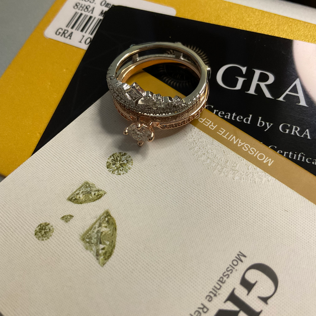Gold ring with diamonds on a GRA (Graff) branded card
