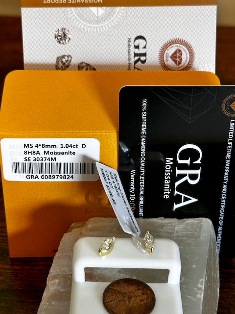 Moissanite earrings with certification card andGRA branding
