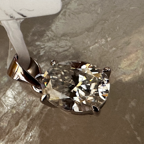 Diamond ring on a textured gray surface