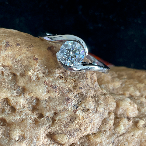 Diamond ring on a textured stone surface