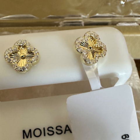Gold earrings on a Moissa branded display card with a price tag.