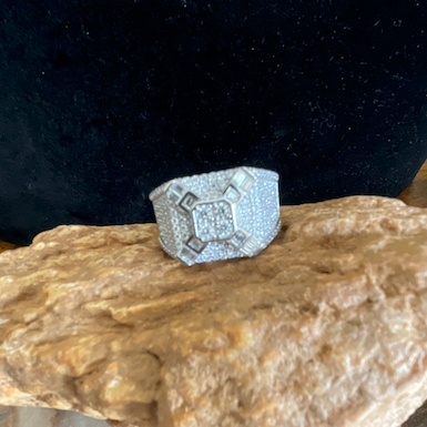 Silver ring with a diamond on a rock