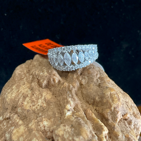 Diamond ring on a rock with a dark background