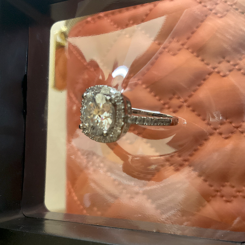 Diamond ring on a brown textured surface