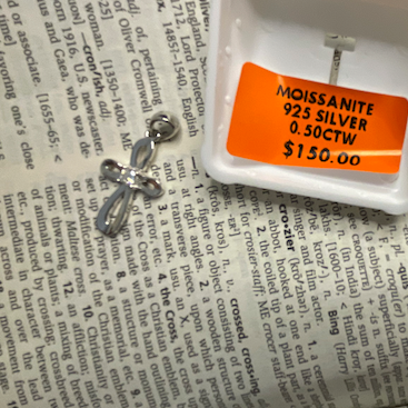 Jewelry with a price tag on a book page