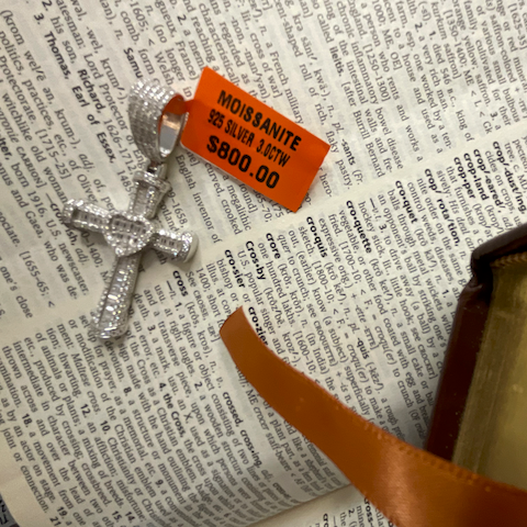 Iced-out moissanite heart cross.