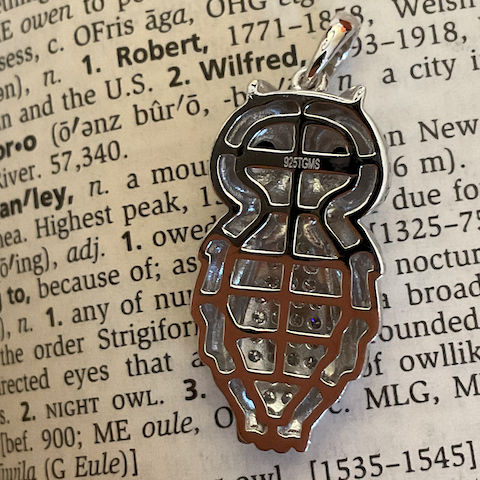 Metallic turtle shell design on a textured background