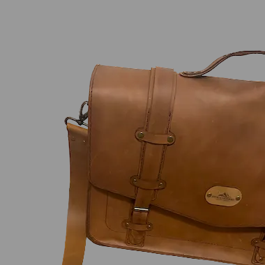 Brown leather satchel bag on a wooden floor